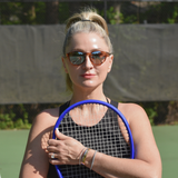 Female model wearing RIA Contour tennis sunglasses